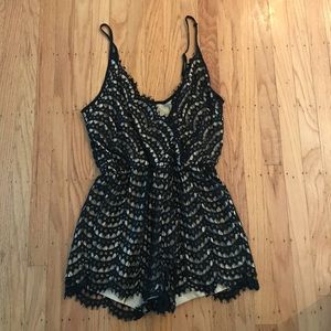 Black lace romper in NEW condition